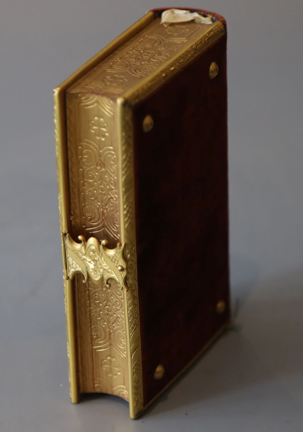 Book of Common Prayer, 12mo, contemporary red velvet, the covers with gilt brass bosses, leaf engraved borders and clasp, inner clasp i